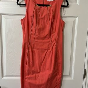 Calvin Klein, coral/peach dress with gold hardware details. Size 4.